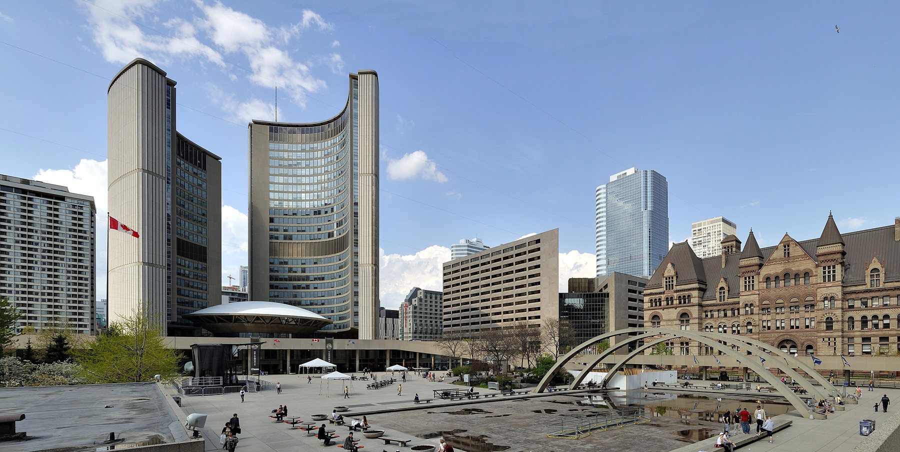 Toronto City Hall, two curved towers around a domed council chamber, with Nathan Phillips Square in front